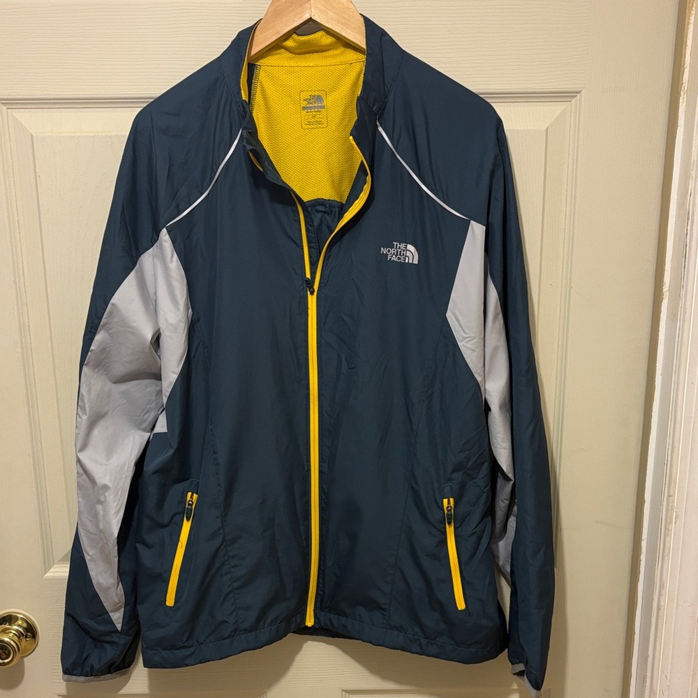 The North Face Men's Navy and Gray Windbreaker with Yellow Accents